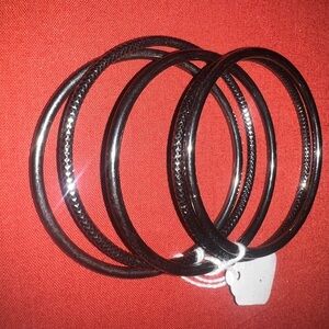 Dark gray, gunmetal-colored bangles, etched‎ 7 in. (17.7cm) in dia. Used